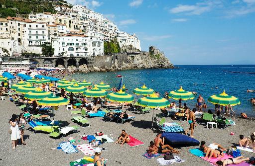 people on beach shore during daytime