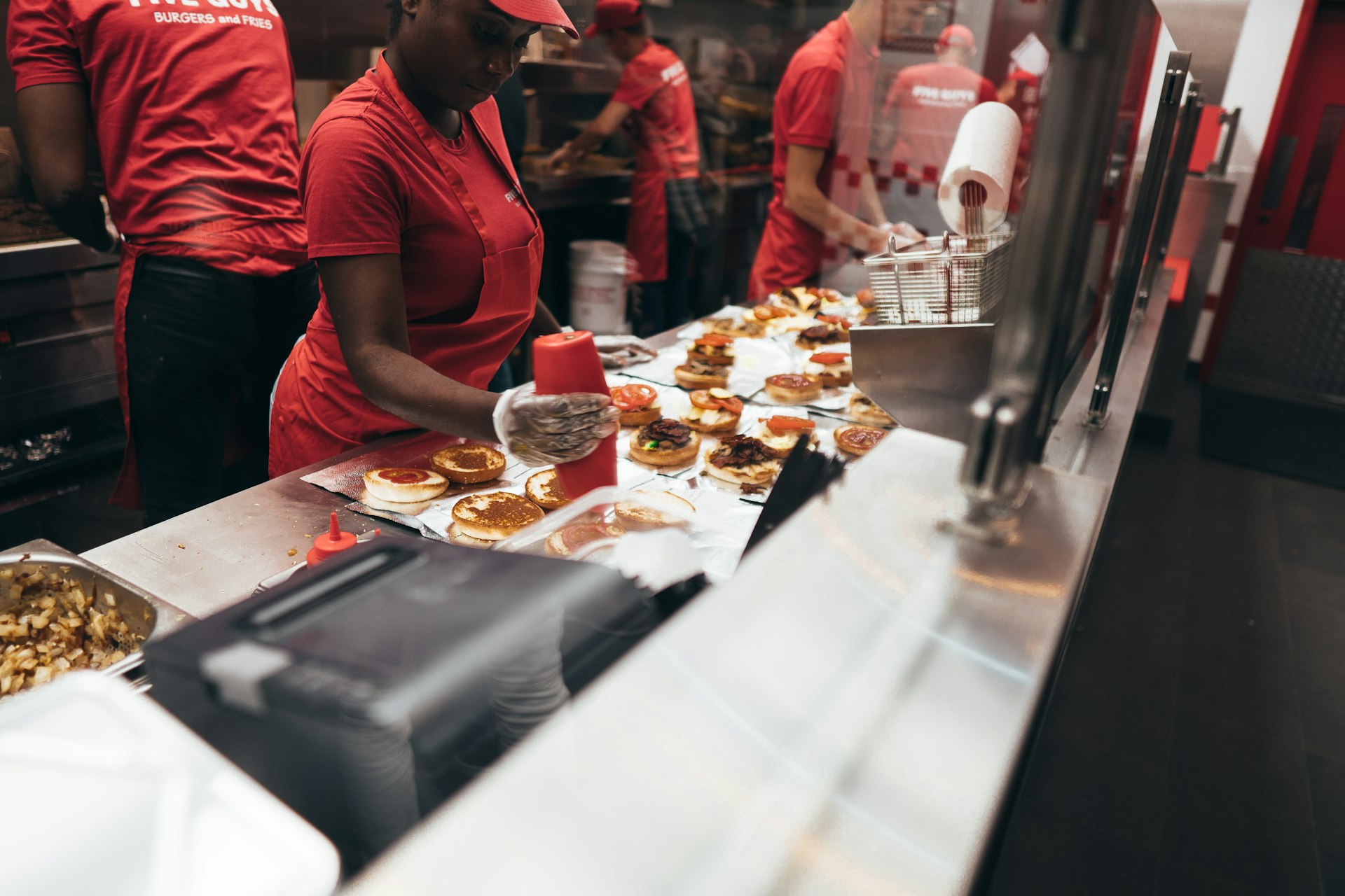 woman preparing a food over the counter